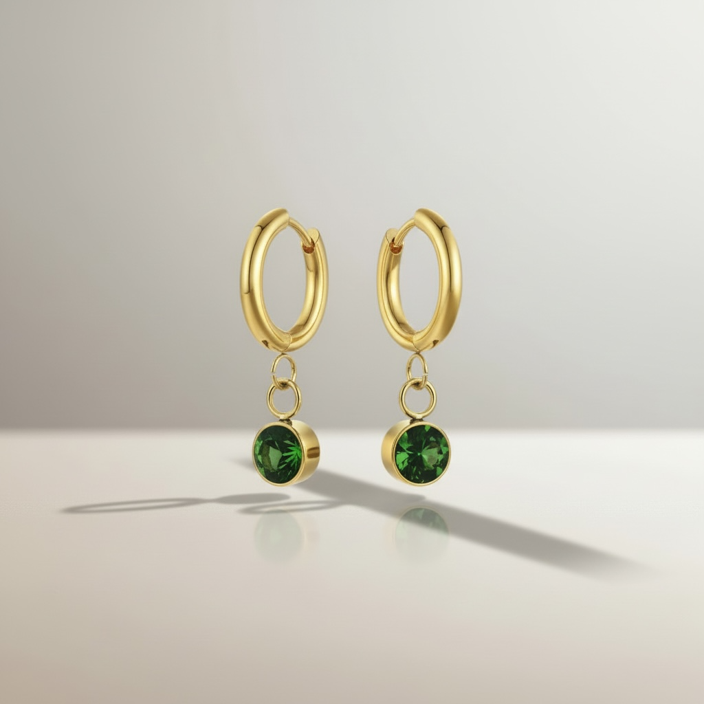 Orecchini Collezione Althea in Acciaio Inox Dorato con Punto Luce Verde – Eleganza Lusso
