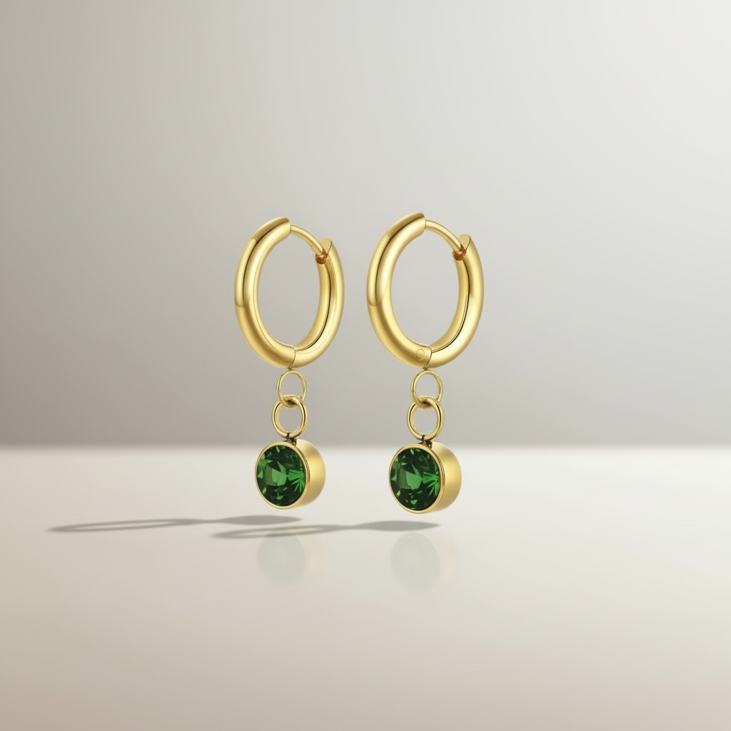 Orecchini Collezione Althea in Acciaio Inox Dorato con Punto Luce Verde – Eleganza Lusso